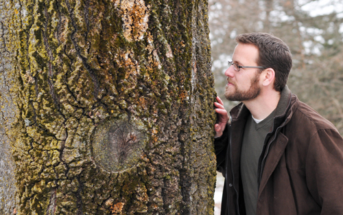 Troy checking out the lichens in The Arboretum. Photo by Brennan Caverhill.