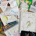 collage of sketching book, pencils and other publications regarding mindfulness and nature